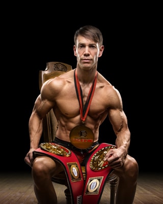 body builder posing in chair