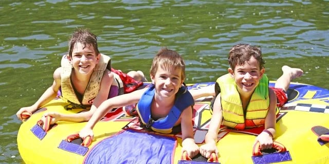 kids playing in a lake
