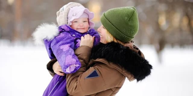 woman and daughter in the snow